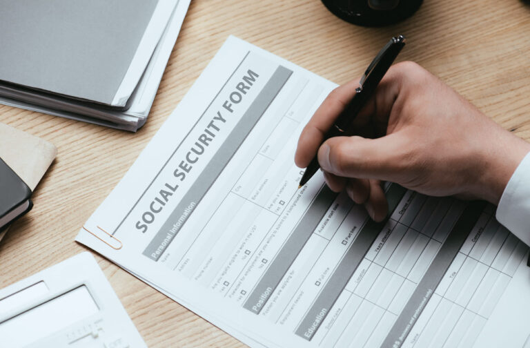Person filling out an application for social security disability benefits