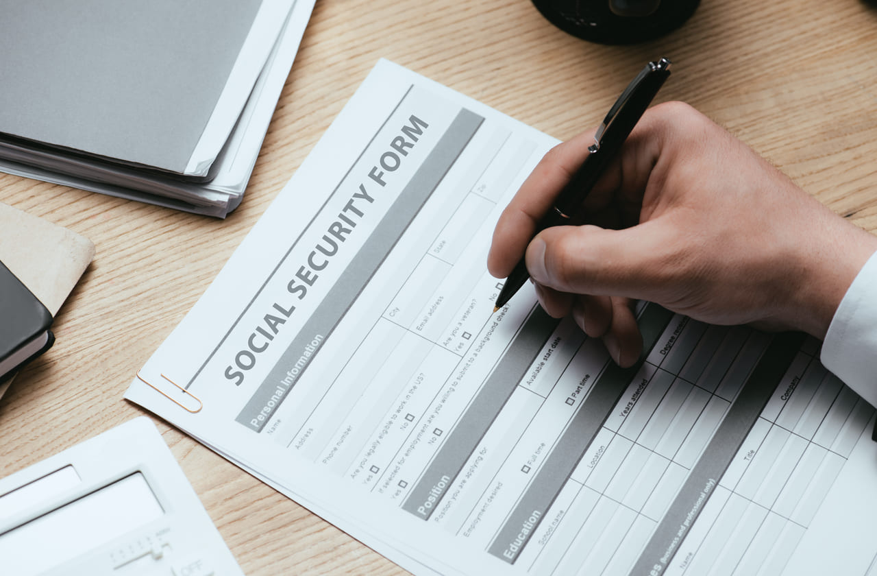 Person filling out an application for social security disability benefits