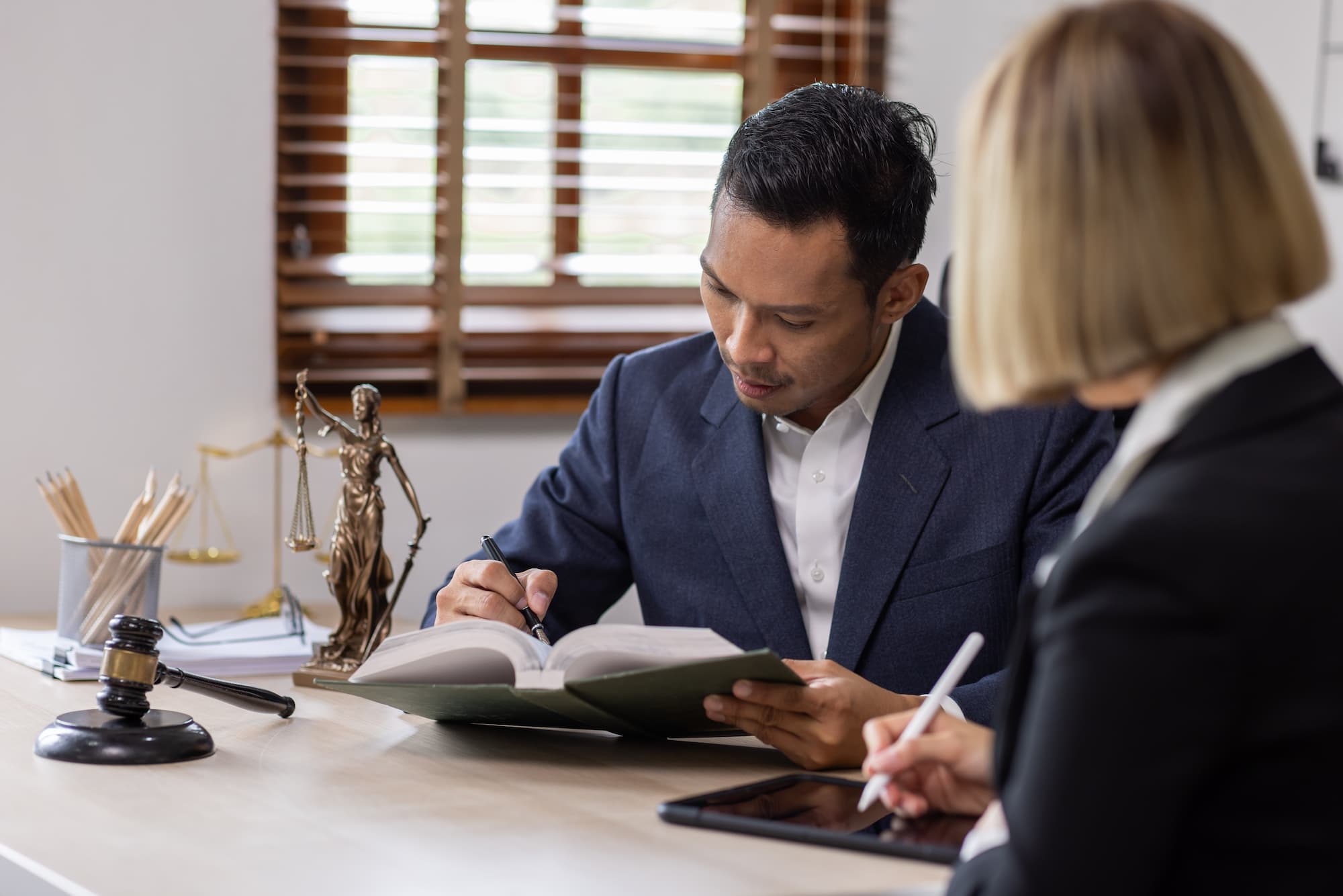 denied workers compensation benefits lawyer meeting with client