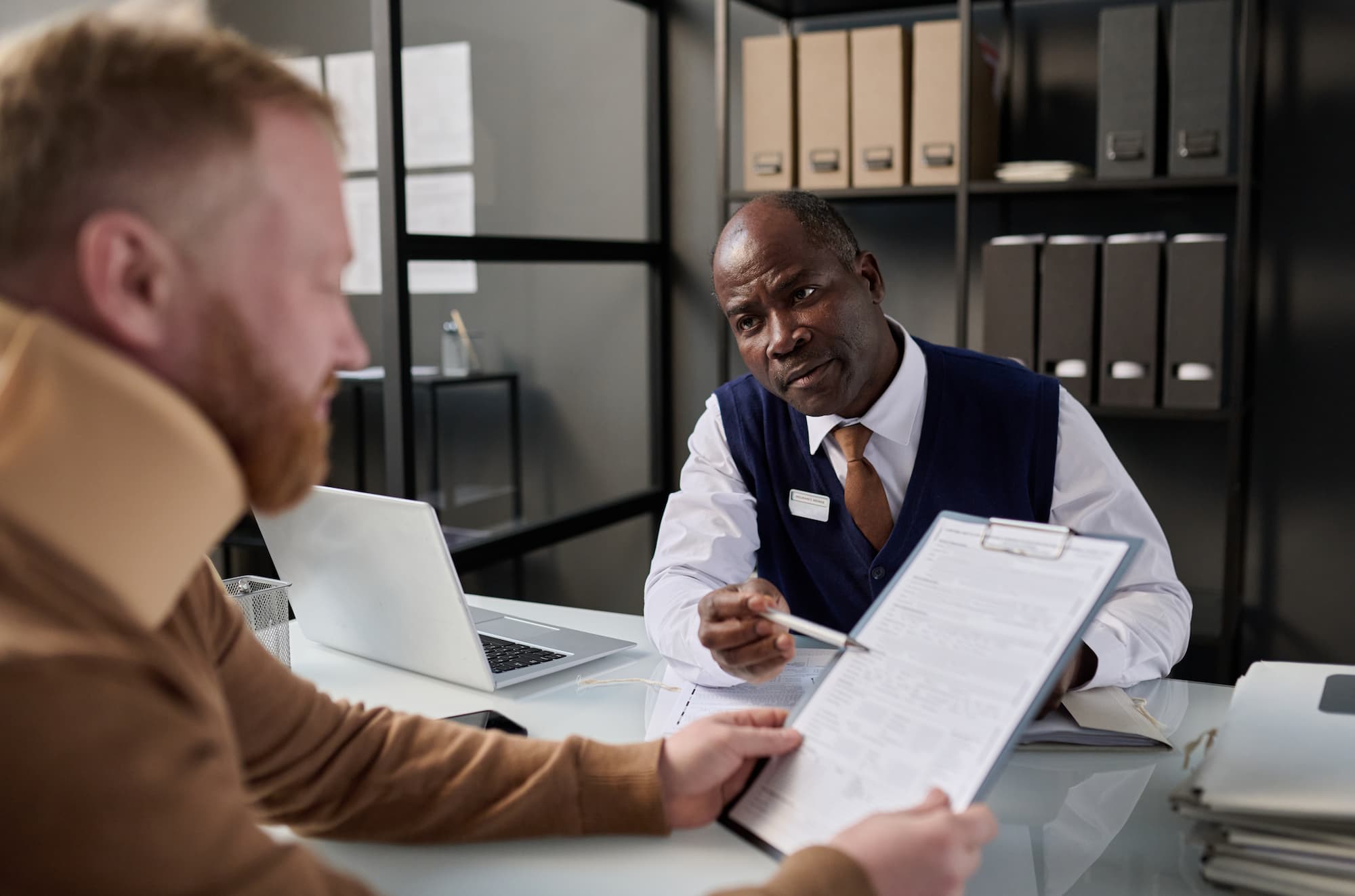 workplace injury lawyer discussing claim with client